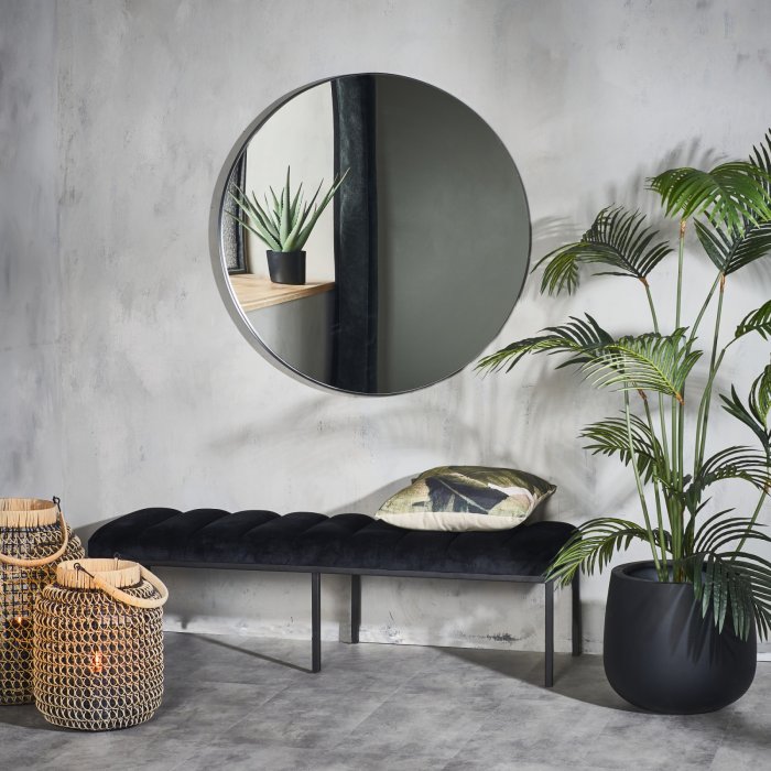 Un grand miroir rond Un grand miroir rond