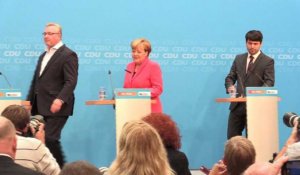 Réfugiés: Merkel reconnaît des erreurs après un revers électoral
