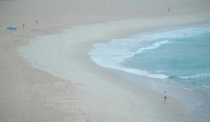 AUSTRALIE: l'aube se lève sur une plage de Sydney au premier jour de la levée des restrictions