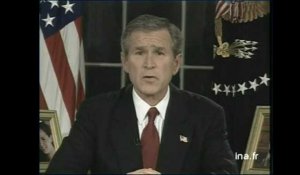Georges W.Bush et Saddam Hussein