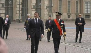 Images de l'arrivée d'Emmanuel et Brigitte Macron au palais royal de Stockholm