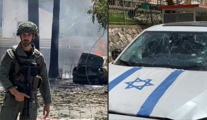 Des soldats israéliens et pompiers sur les lieux d'une frappe du Hezbollah libanais