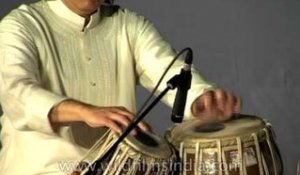 Tabla maestro Ustad Zakir Hussain perform during a concert