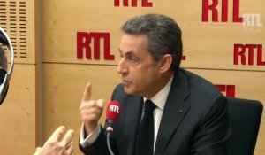 Nicolas Sarkozy assure que l'UMP n'a "aucun point commun programmatique avec le FN"