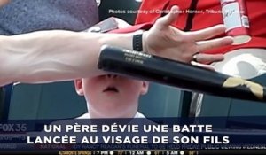 Un père dévie une batte de baseball lancée au visage de son fils