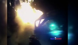 Sauvetage d'un homme dans une voiture en feu par un policier