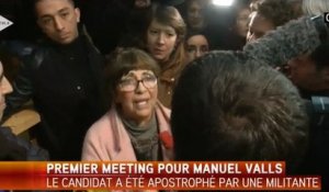 Valls pris à partie par une militante après son meeting