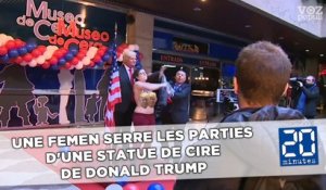 Une Femen serre les parties d'une statue de cire de Donald Trump