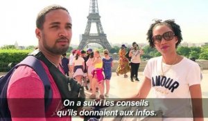 Canicule: à Paris, les touristes se protègent du soleil