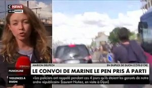 Regardez le convoi de Marine Le Pen pris à parti ce soir à Dijon alors qu'elle quitte la salle dans laquelle elle vient de faire sa conférence de presse