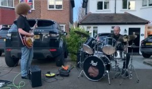 Keeping the beat: Police Officer plays drums at Coronation party!