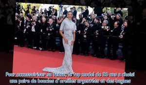 Cannes 2023  Tina Kunakey illumine le tapis rouge en solo dans une longue robe blanche (2)