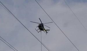 Un hélicoptère coupe des arbres trop proche de lignes électriques!