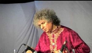 Pandit Shiv Kumar Sharma playing classical instrument at the concert