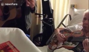 Famous guitarist George Cole jams with his old guitar teacher in hospital