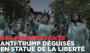 Des manifestants anti-trump déguisés en statue de la liberté