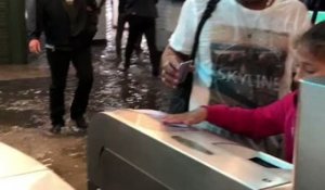 Commuters Walk Through Flooded Metro Station in Paris