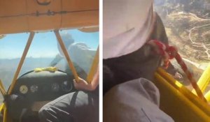 Il sort du cockpit de l'avion pour redémarrer le moteur