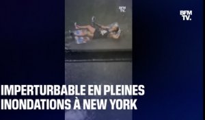 New York: imperturbable, il fume sa chicha alors que les rues autour de lui sont inondées