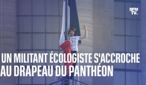 Un militant du collectif écologiste "Dernière rénovation" s'accroche au drapeau du Panthéon