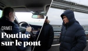 Poutine conduit une voiture sur le pont de Crimée, qui avait été endommagé par une explosion