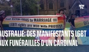 Des militants LGBT protestent lors des funérailles du cardinal australien George Pell